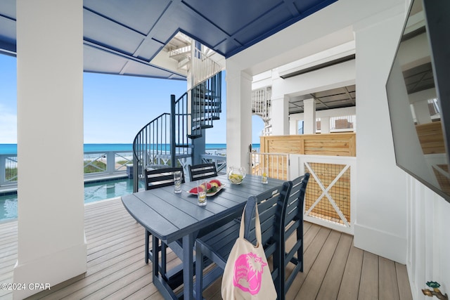 wooden deck featuring a water view