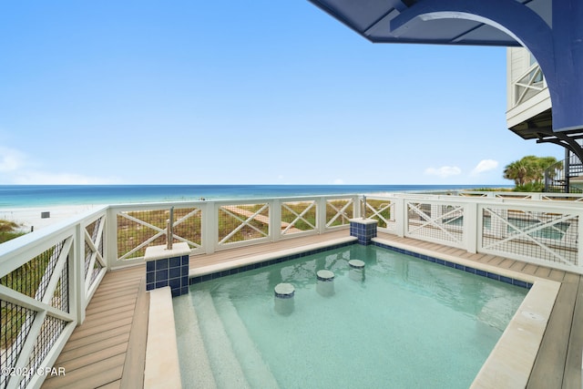 view of pool featuring a beach view and a water view