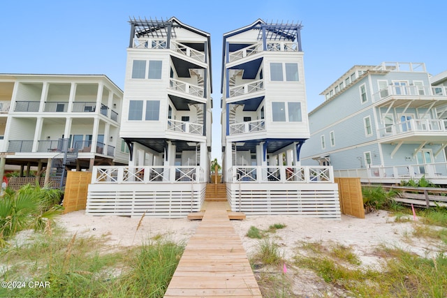 rear view of property with a balcony