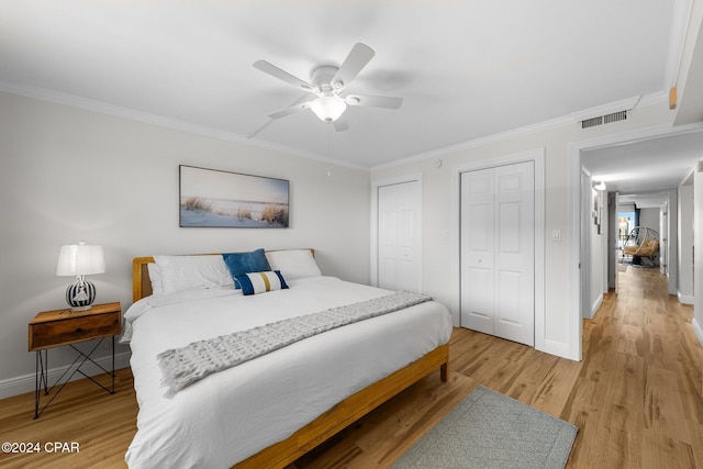 bedroom with ceiling fan, light hardwood / wood-style floors, and ornamental molding