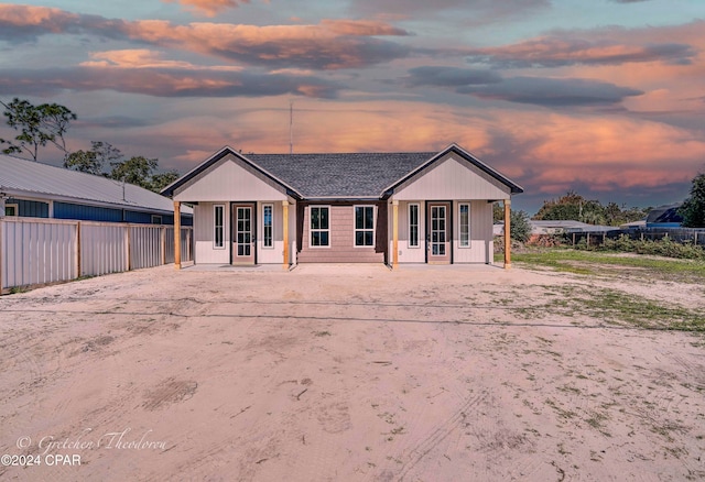 view of back house at dusk