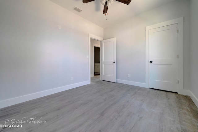 unfurnished bedroom featuring ceiling fan and light hardwood / wood-style flooring