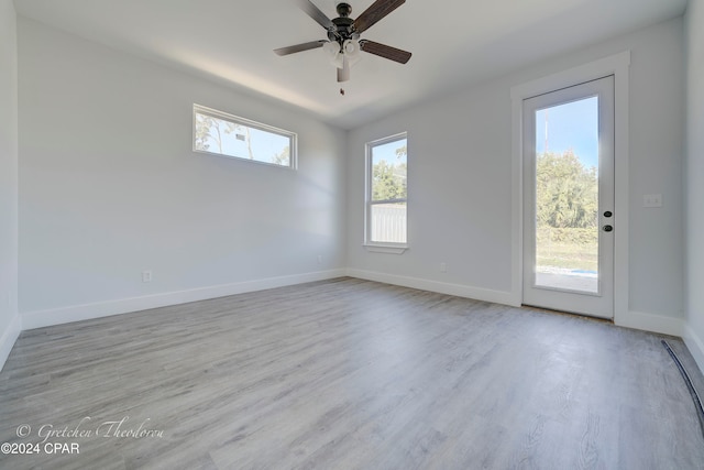 spare room featuring ceiling fan and light hardwood / wood-style flooring