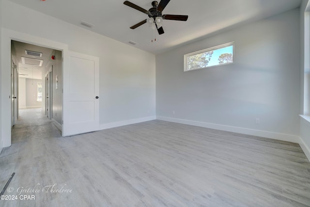 unfurnished room featuring ceiling fan and light hardwood / wood-style flooring