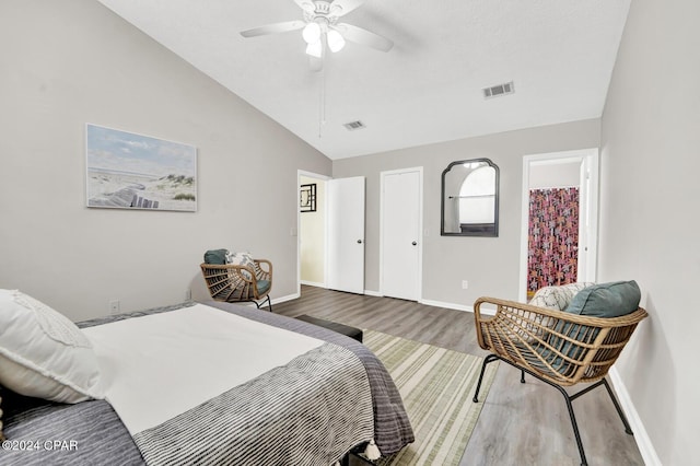 bedroom featuring high vaulted ceiling, hardwood / wood-style floors, and ceiling fan