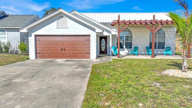 ranch-style home featuring a garage and a front yard