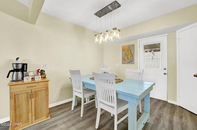 dining space featuring wood-type flooring