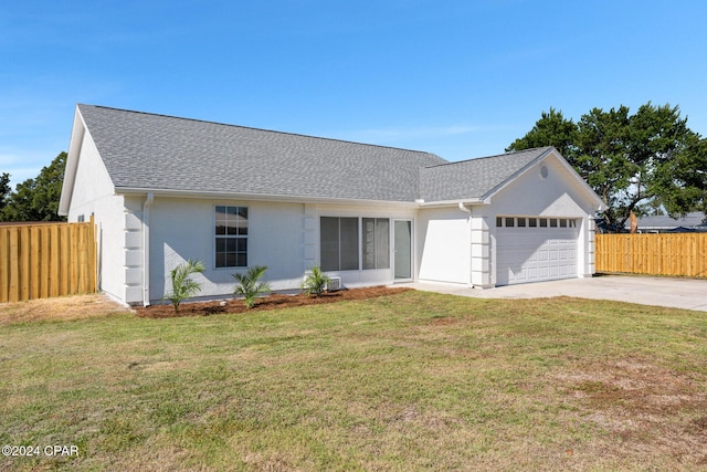 ranch-style home featuring a front yard and a garage