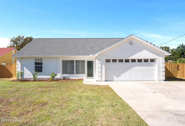 single story home with a front lawn and a garage