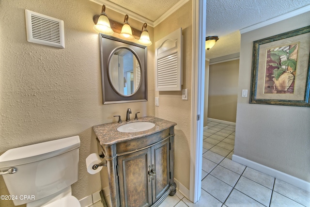 bathroom with tile patterned floors, toilet, a textured ceiling, ornamental molding, and vanity