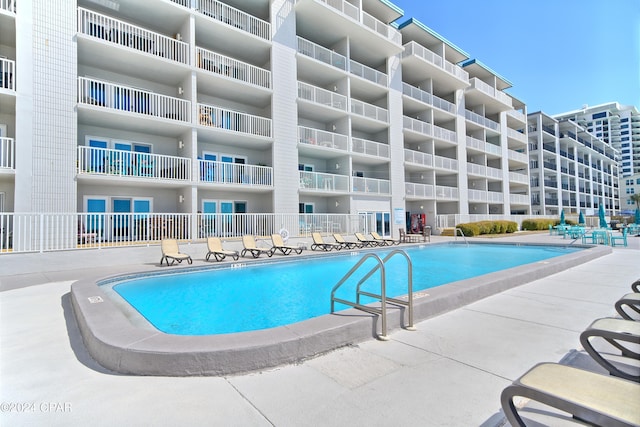 view of swimming pool featuring a patio area