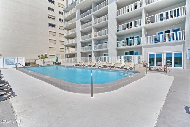 view of pool featuring a patio