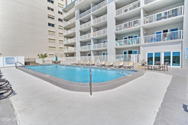 view of pool featuring a patio