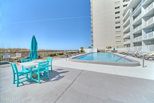 view of pool featuring a patio area