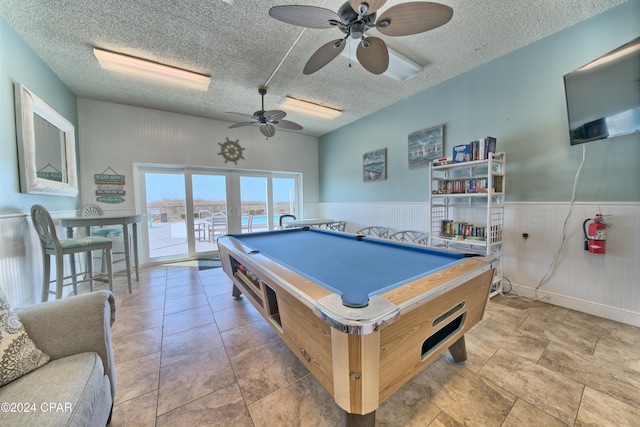 recreation room with pool table, a textured ceiling, and ceiling fan