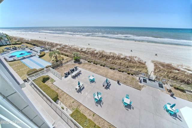 drone / aerial view with a water view and a view of the beach