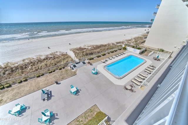 bird's eye view featuring a beach view and a water view