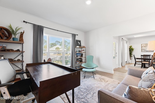 office space featuring wood finished floors and baseboards