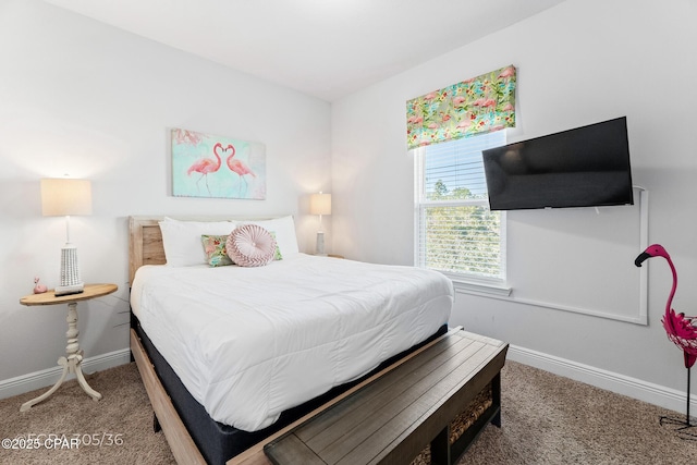 carpeted bedroom with baseboards