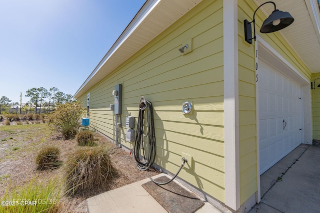 view of side of property with a garage