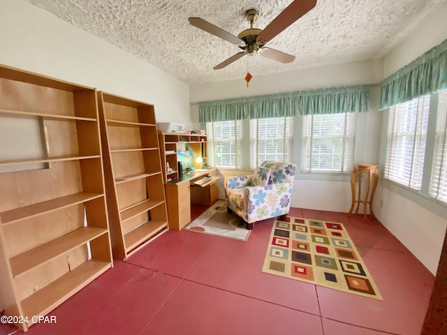 unfurnished room featuring a healthy amount of sunlight, a textured ceiling, and tile patterned floors