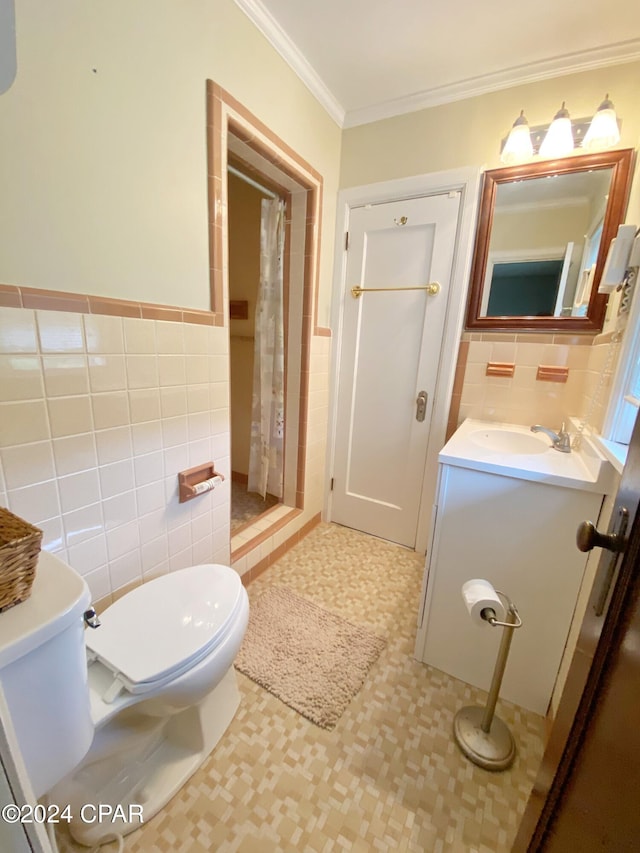 bathroom with toilet, tile walls, curtained shower, and crown molding