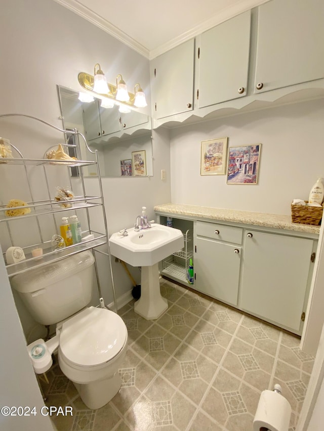 bathroom featuring toilet and ornamental molding