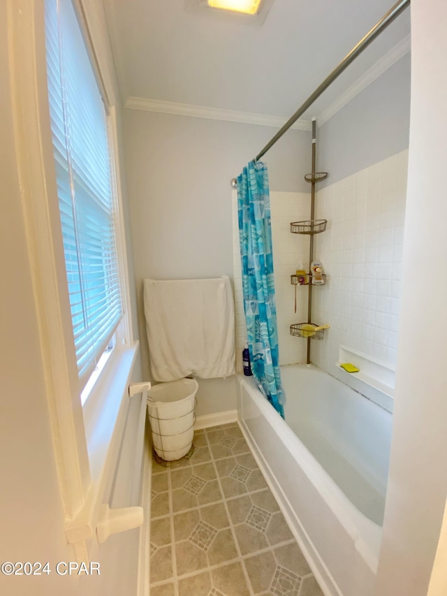 bathroom featuring tile patterned flooring, ornamental molding, and shower / bathtub combination with curtain