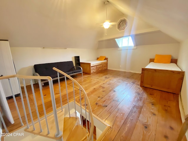 bonus room with light hardwood / wood-style flooring, ceiling fan, and vaulted ceiling