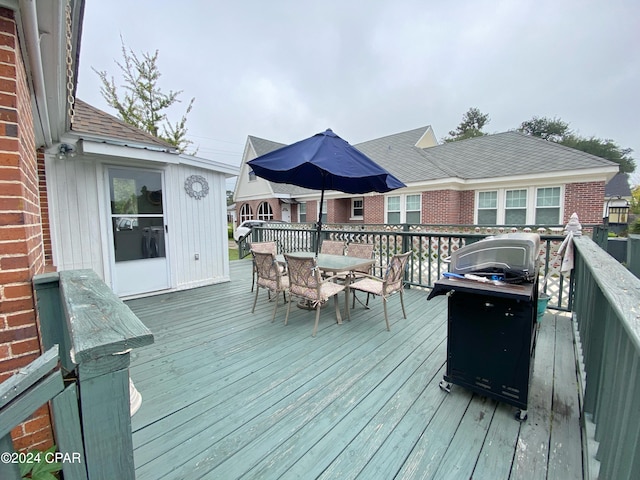 wooden deck featuring area for grilling