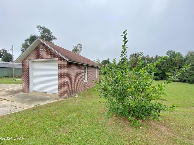 garage featuring a yard