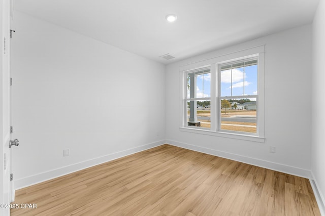 spare room featuring light hardwood / wood-style flooring