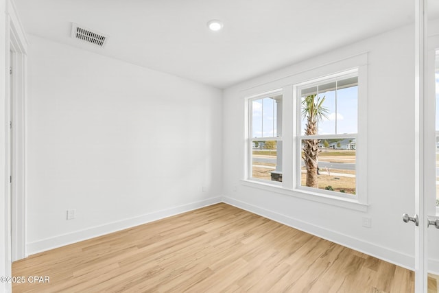 unfurnished bedroom with light hardwood / wood-style floors and a closet