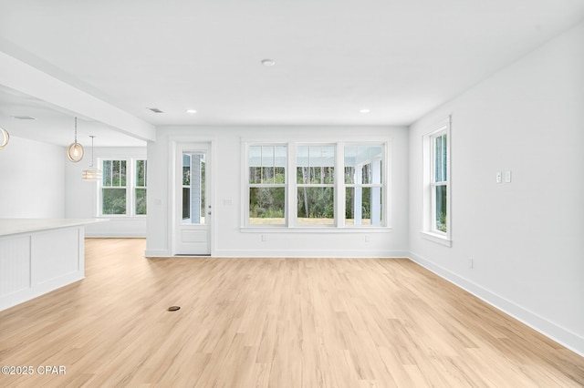 unfurnished living room featuring light hardwood / wood-style floors