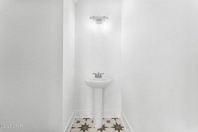 bathroom featuring vanity and a tile shower