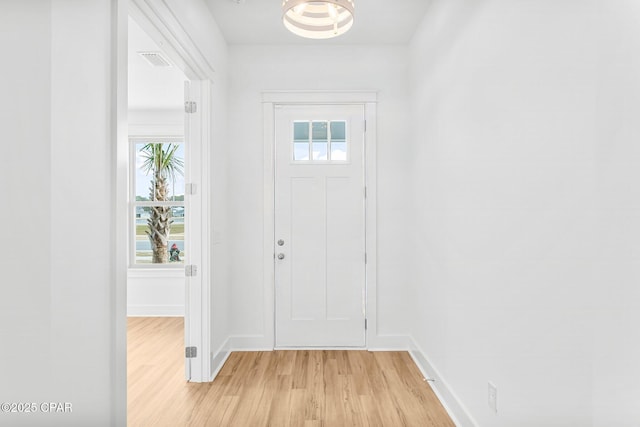 foyer entrance with light wood-type flooring