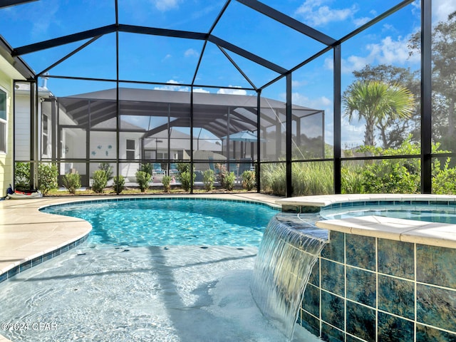 view of pool with glass enclosure and pool water feature