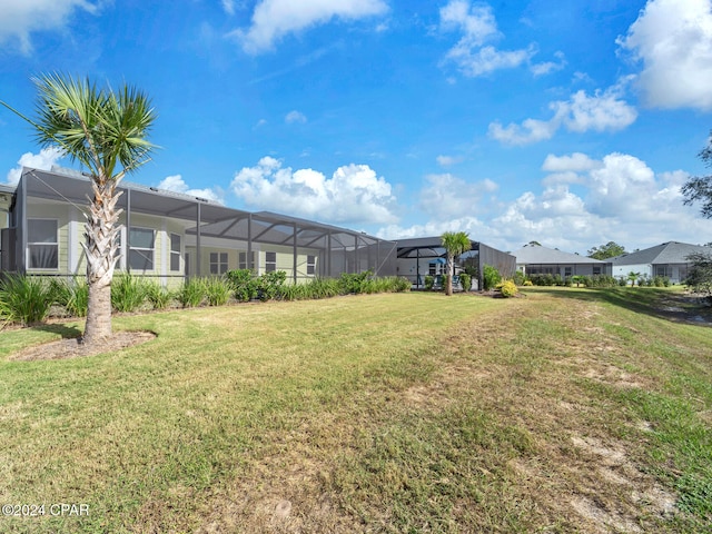 view of yard with a lanai