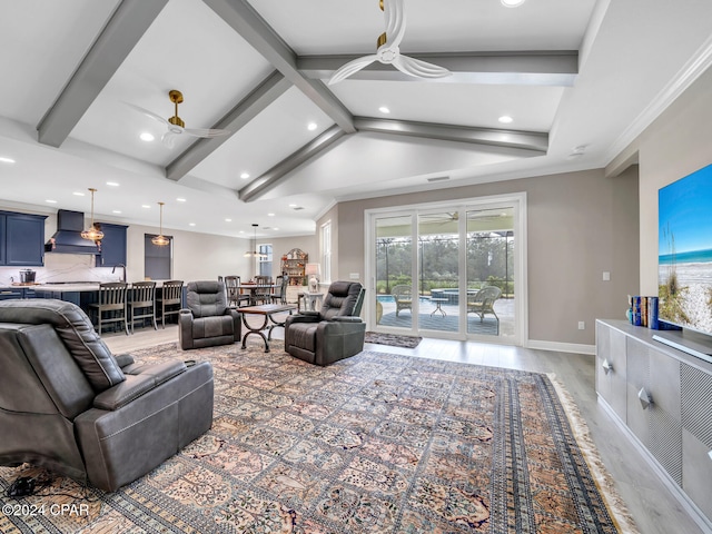 living room with hardwood / wood-style floors, a wealth of natural light, and ceiling fan