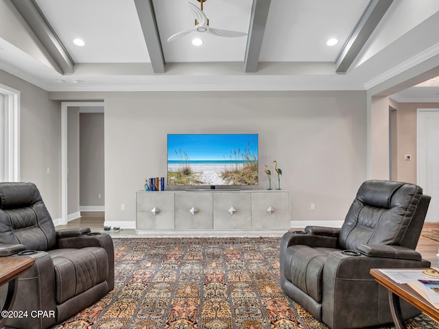 living room with ceiling fan, hardwood / wood-style flooring, ornamental molding, and beam ceiling