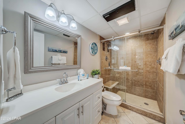 6201 Thomas Dr Unit 302, Panama City, FL 32408 - bathroom featuring toilet, vanity, tile patterned floors, and a shower stall