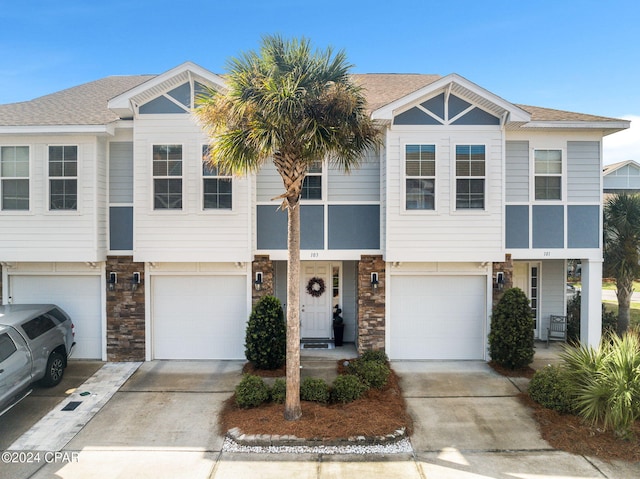 multi unit property featuring a garage