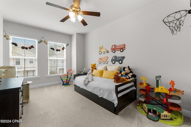 carpeted bedroom featuring ceiling fan