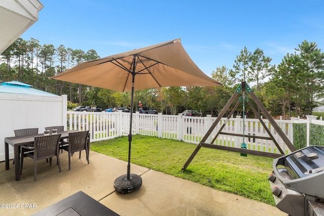 view of patio / terrace with a playground and grilling area