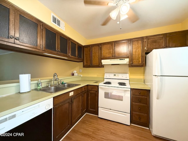 kitchen with white appliances, sink, ceiling fan, and light hardwood / wood-style flooring