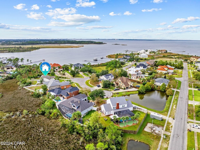 birds eye view of property featuring a water view