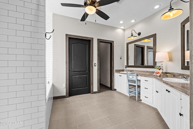 bathroom featuring ceiling fan and vanity