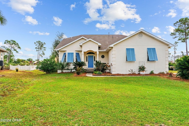 ranch-style house featuring a front lawn