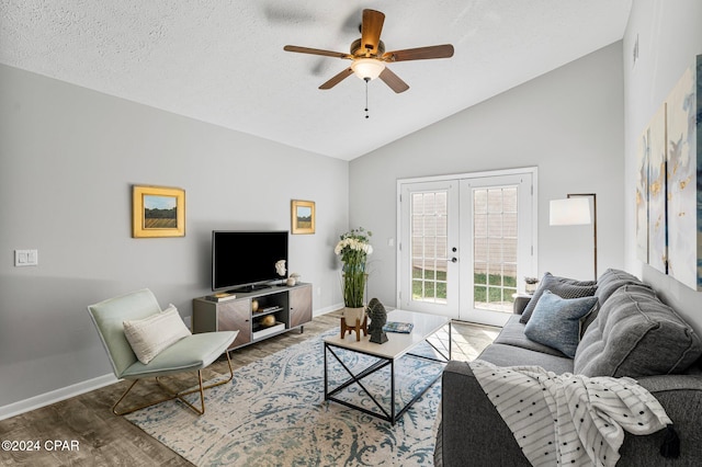 living room with high vaulted ceiling, french doors, hardwood / wood-style flooring, ceiling fan, and a textured ceiling