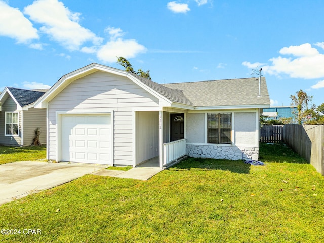 ranch-style house with a garage and a front lawn